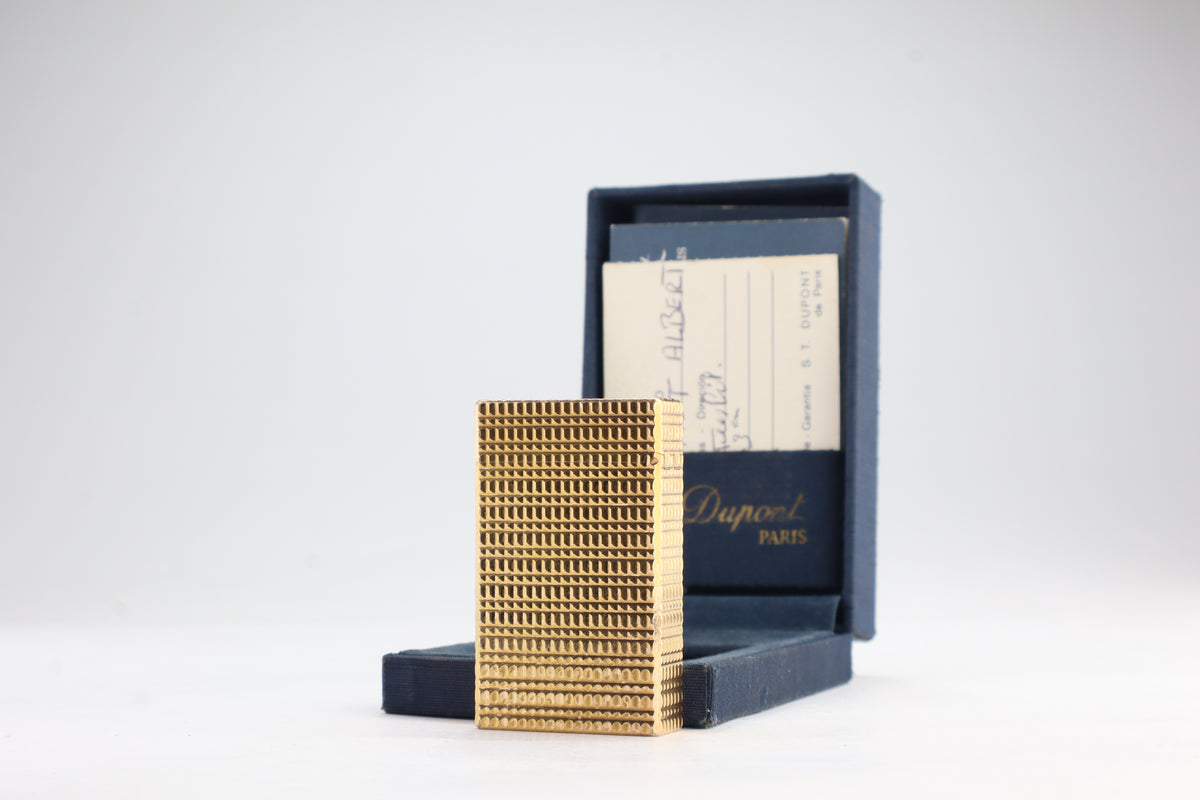 S.T. Dupont Ligne 1 BR large gold lighter with a squared quadrillage pattern, with its navy box and guarantee card