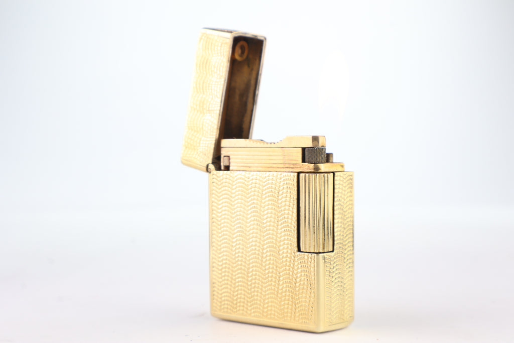 Solid 18k gold S.T. Dupont Ligne 1 BS small lighter with a fine wave engine-turned pattern