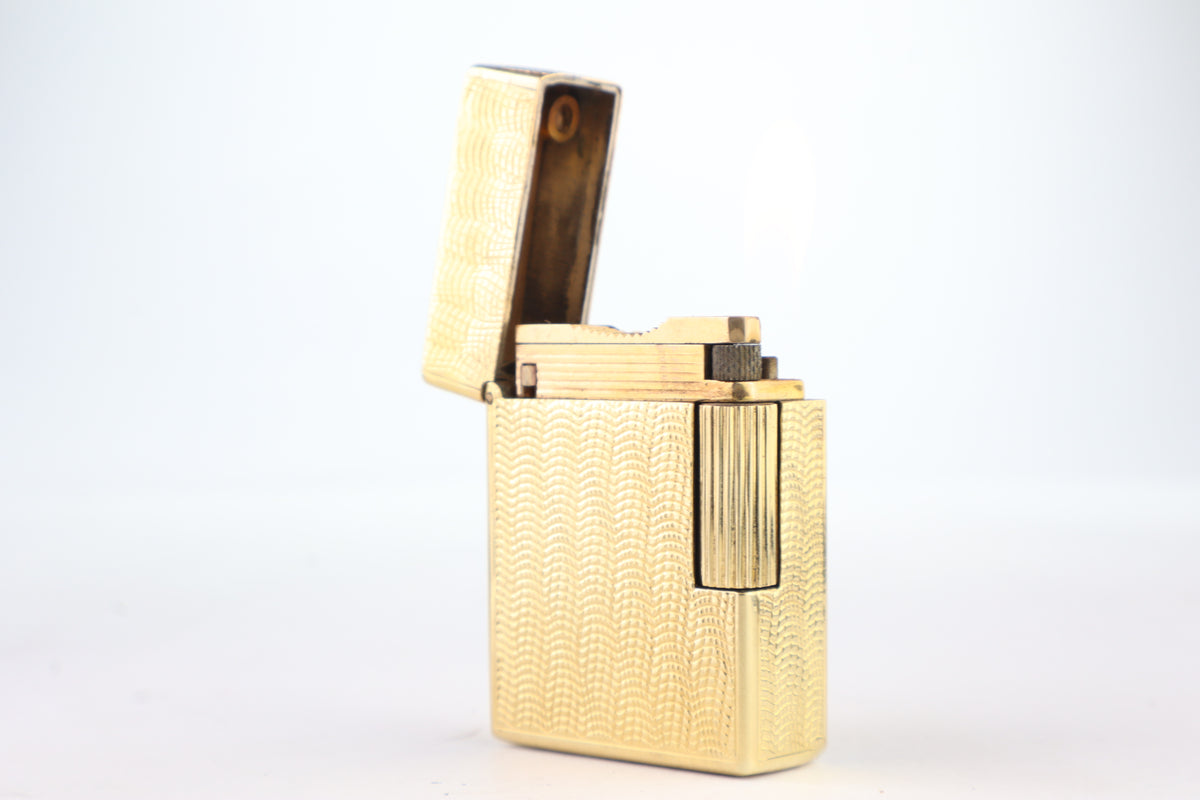 Solid 18k gold S.T. Dupont Ligne 1 BS small lighter with a fine wave engine-turned pattern