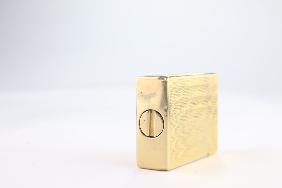 Base of the solid gold S.T. Dupont Ligne 1 BS, stamped 750 beside the adjustment screw, the millesimal mark for 18 carat gold