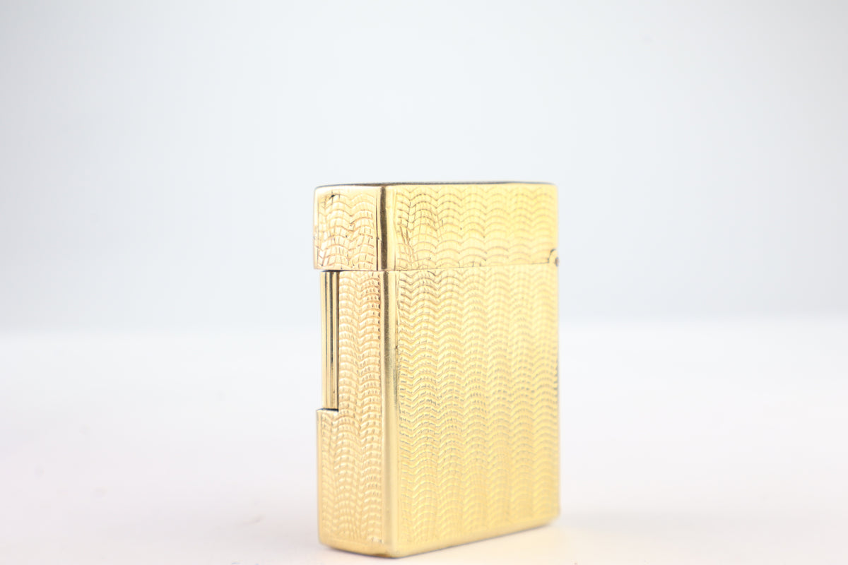 Solid 18k gold S.T. Dupont Ligne 1 BS small lighter with a fine wave engine-turned pattern