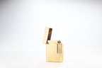 Solid 18k gold S.T. Dupont Ligne 1 BS small lighter with a fine wave engine-turned pattern