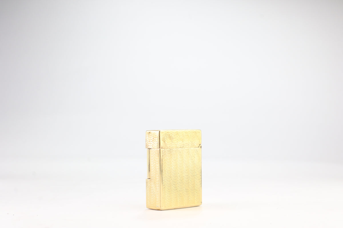 Solid 18k gold S.T. Dupont Ligne 1 BS small lighter with a fine wave engine-turned pattern