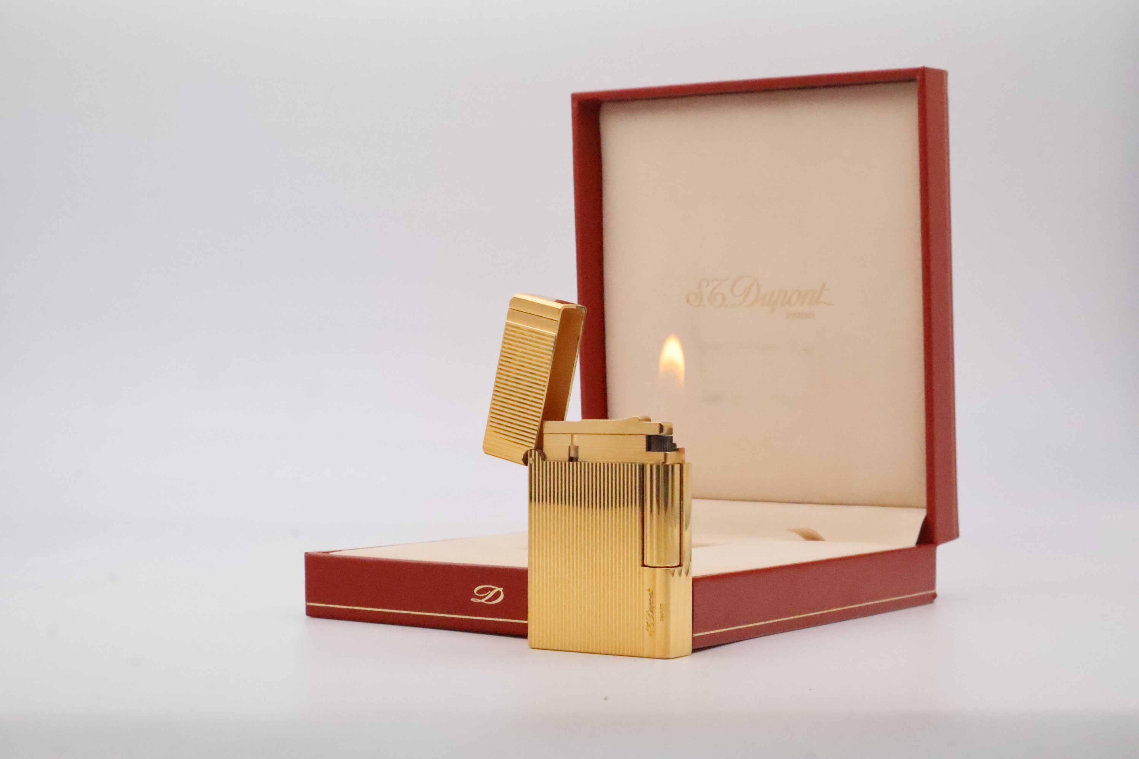S.T. Dupont Gatsby gold lighter, new old stock condition, with original box