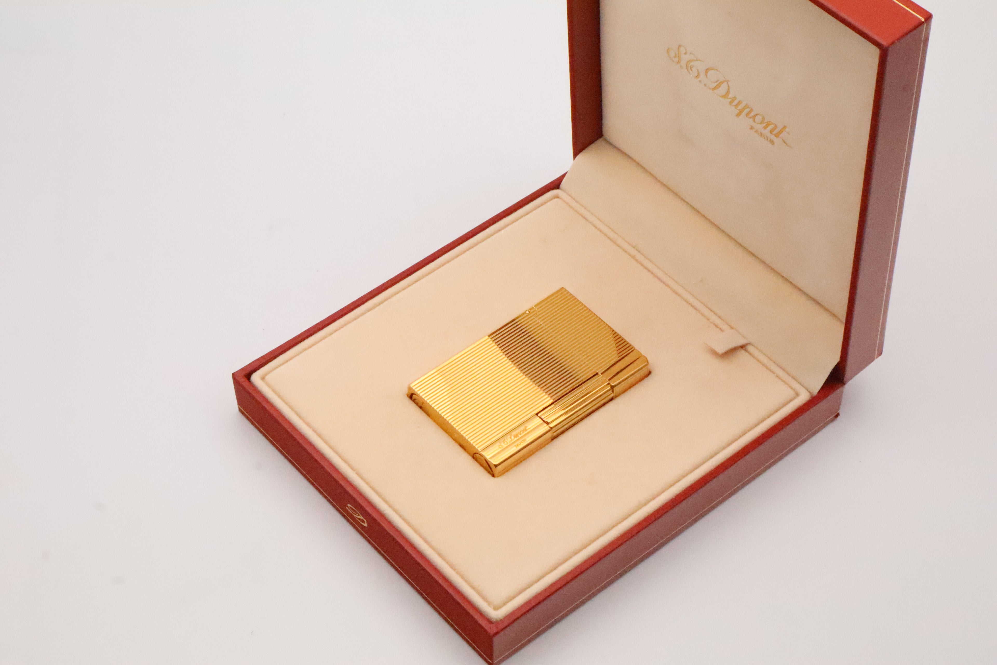 S.T. Dupont Gatsby gold lighter, new old stock condition, with original box