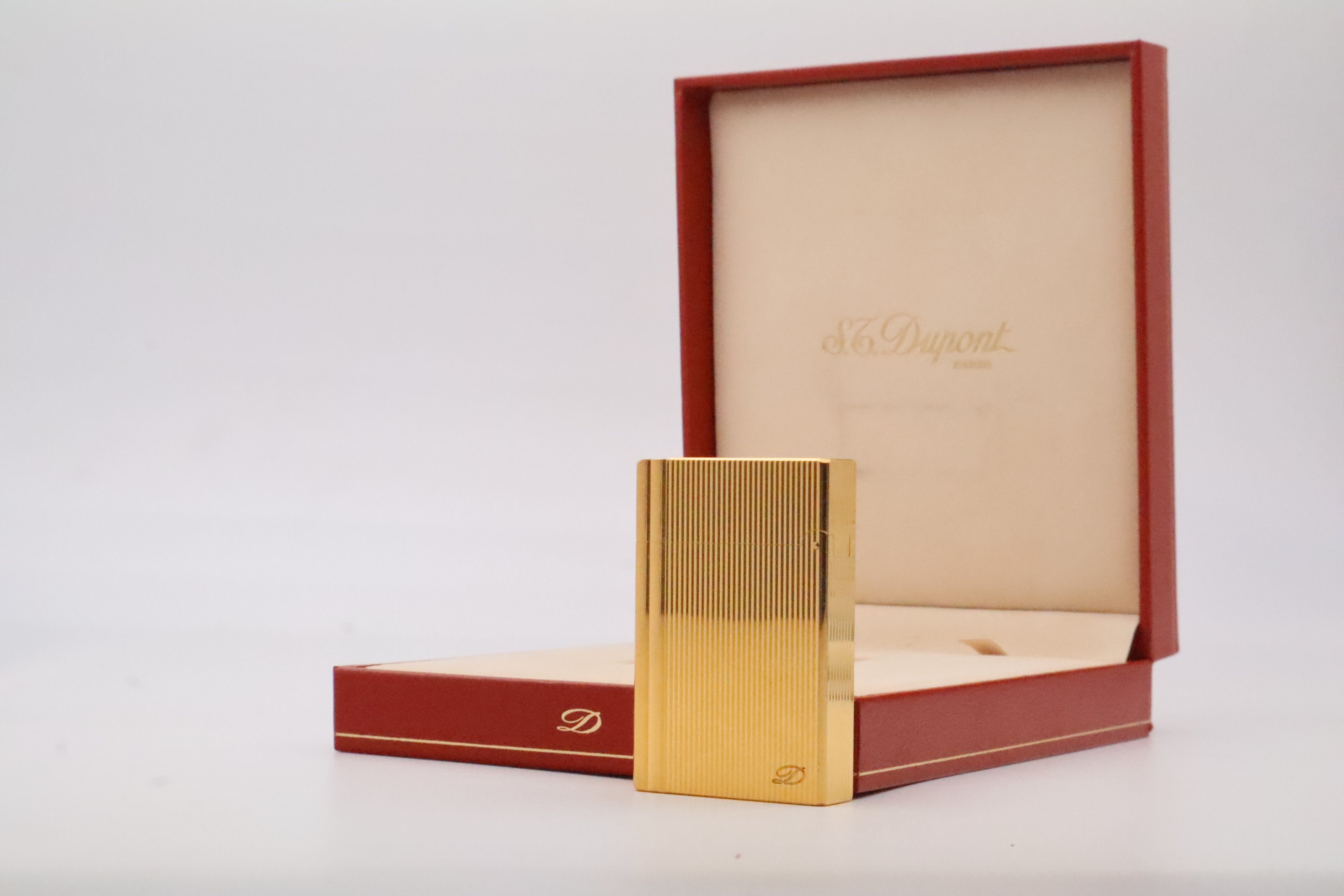 S.T. Dupont Gatsby gold lighter, new old stock condition, with original box