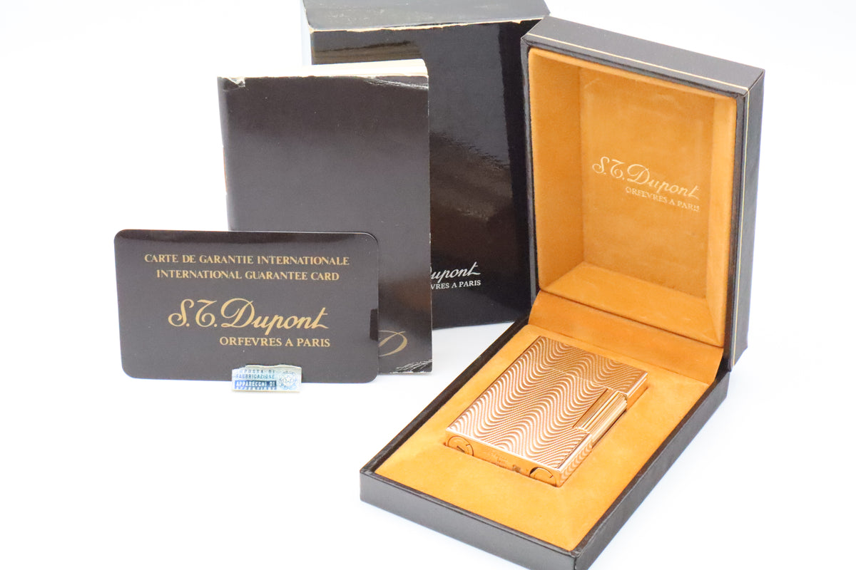 S.T. Dupont Ligne 2 Petit Modele small gold wavy pattern lighter, new old stock, with box and papers