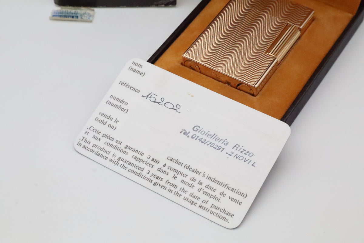 S.T. Dupont Ligne 2 Petit Modele small gold wavy pattern lighter, new old stock, with box and papers