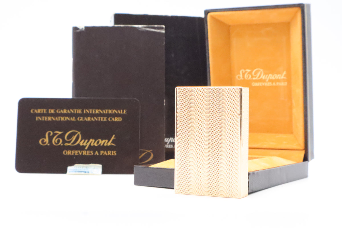 S.T. Dupont Ligne 2 Petit Modele small gold wavy pattern lighter, new old stock, with box and papers