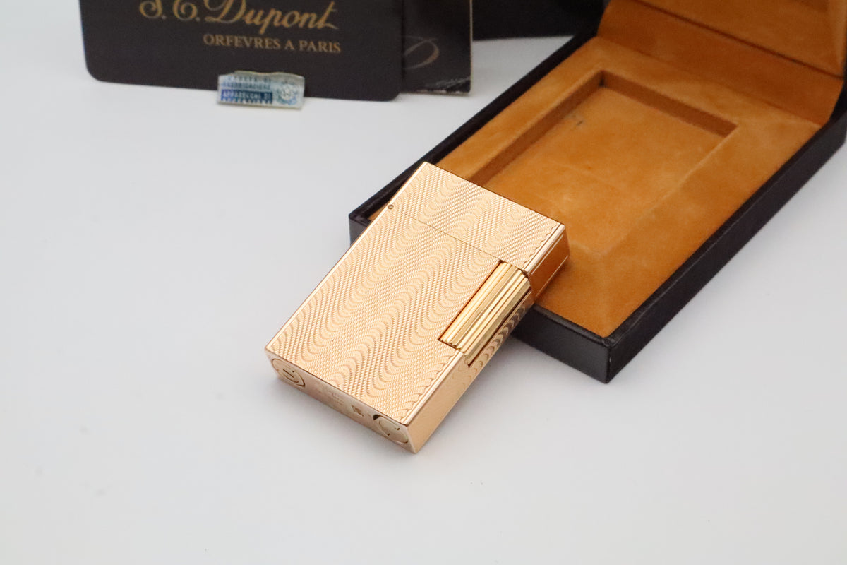 S.T. Dupont Ligne 2 Petit Modele small gold wavy pattern lighter, new old stock, with box and papers