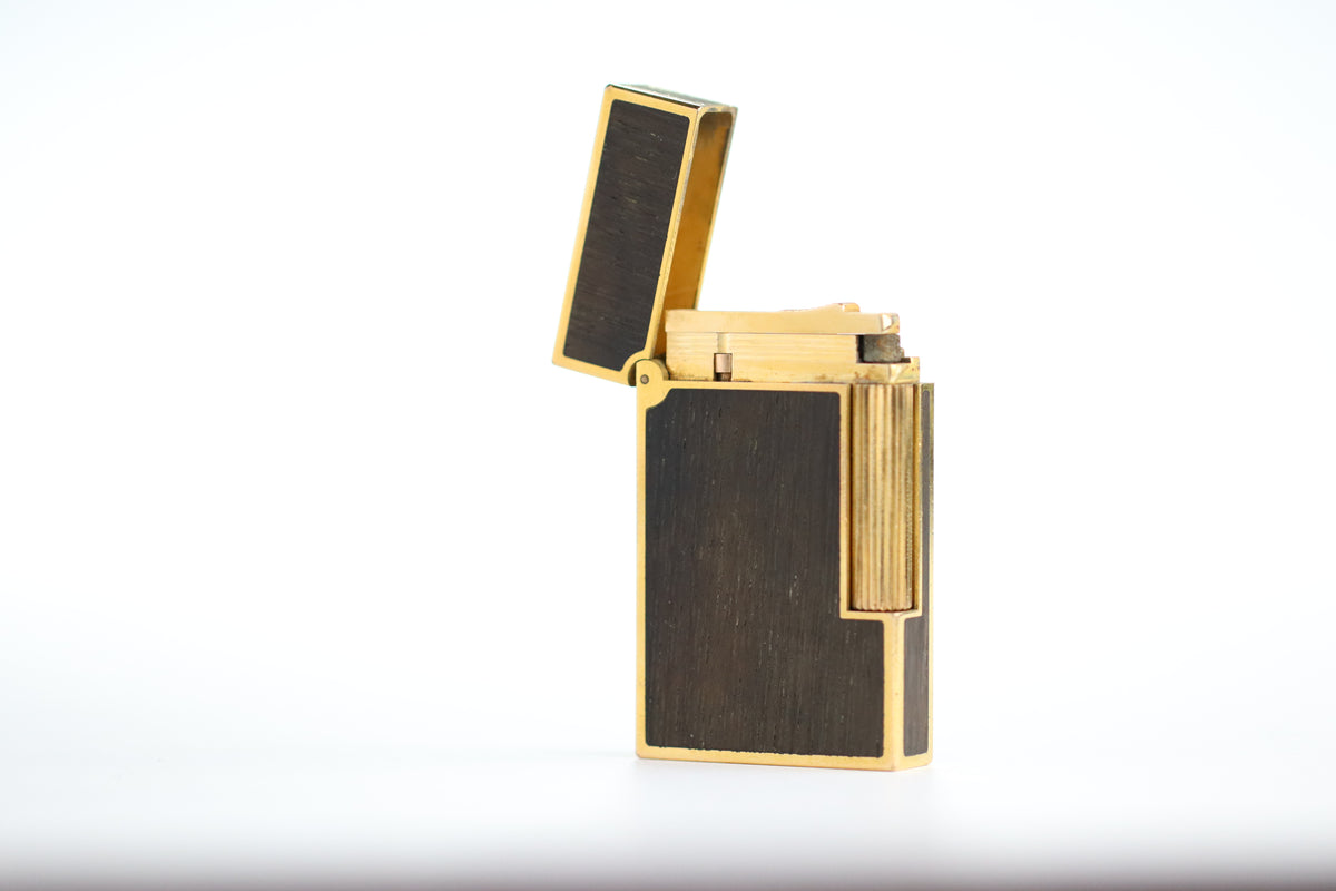 Prototype S.T. Dupont Ligne 2 Grand Modele lighter in gold plate with real wood inlay panels, marked MODELE on the base
