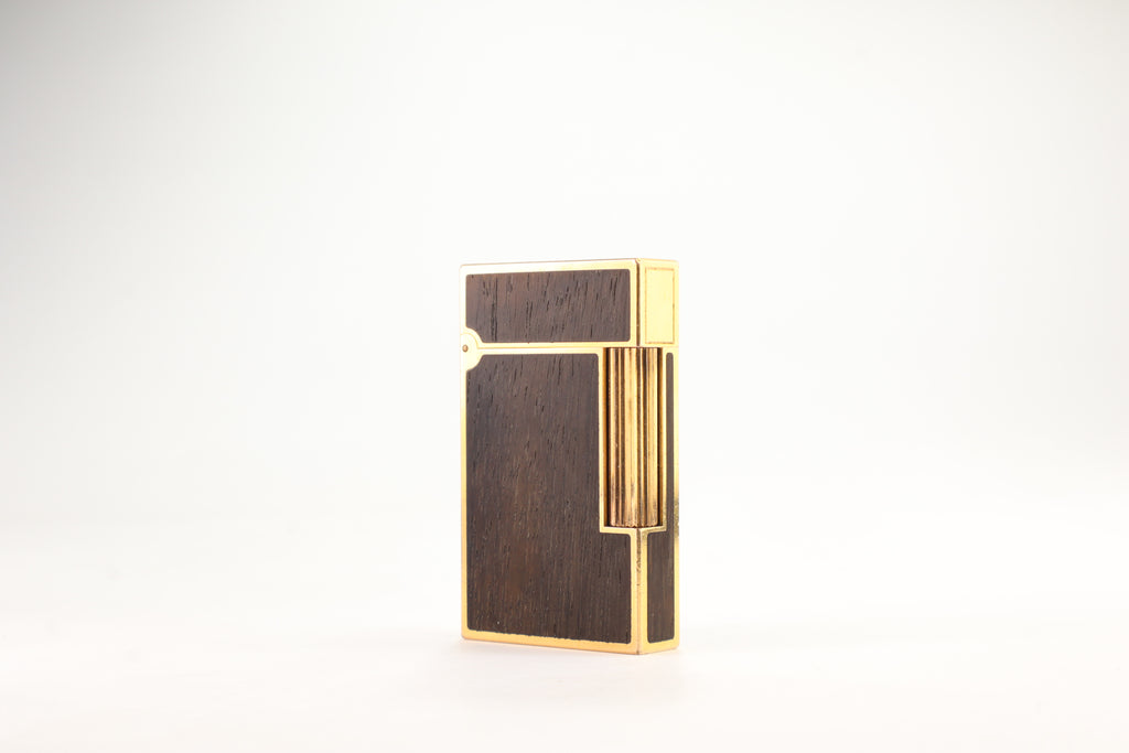 Prototype S.T. Dupont Ligne 2 Grand Modele lighter in gold plate with real wood inlay panels, marked MODELE on the base