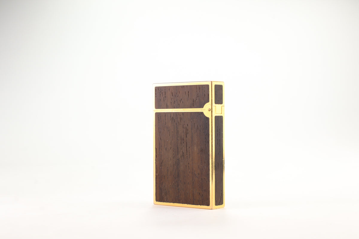 Prototype S.T. Dupont Ligne 2 Grand Modele lighter in gold plate with real wood inlay panels, marked MODELE on the base
