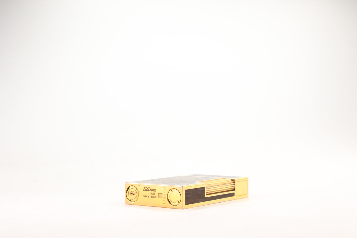 Prototype S.T. Dupont Ligne 2 Grand Modele lighter in gold plate with real wood inlay panels, marked MODELE on the base