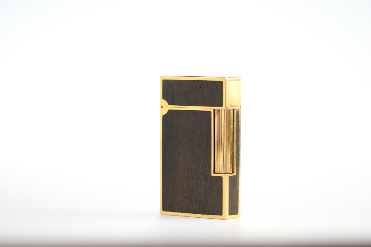 Prototype S.T. Dupont Ligne 2 Grand Modele lighter in gold plate with real wood inlay panels, marked MODELE on the base