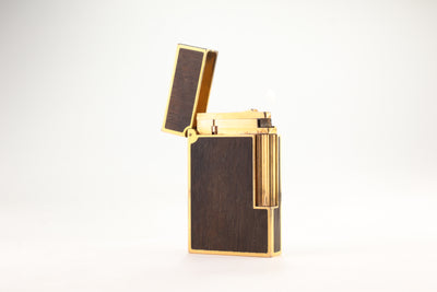 Prototype S.T. Dupont Ligne 2 Grand Modele lighter in gold plate with real wood inlay panels, marked MODELE on the base