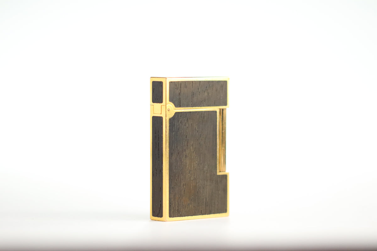 Prototype S.T. Dupont Ligne 2 Grand Modele lighter in gold plate with real wood inlay panels, marked MODELE on the base