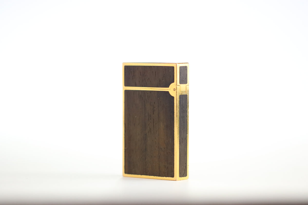 Prototype S.T. Dupont Ligne 2 Grand Modele lighter in gold plate with real wood inlay panels, marked MODELE on the base
