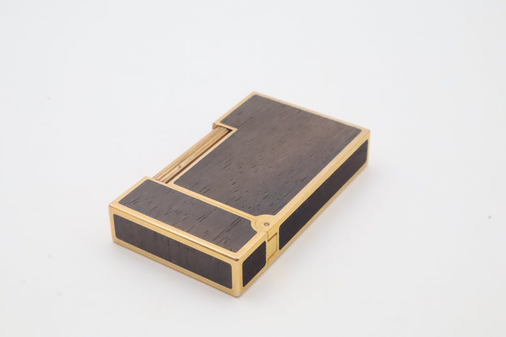 S.T. Dupont Ligne 2 gold plated lighter with dark wood inlay panels, marked MODELE on the base
