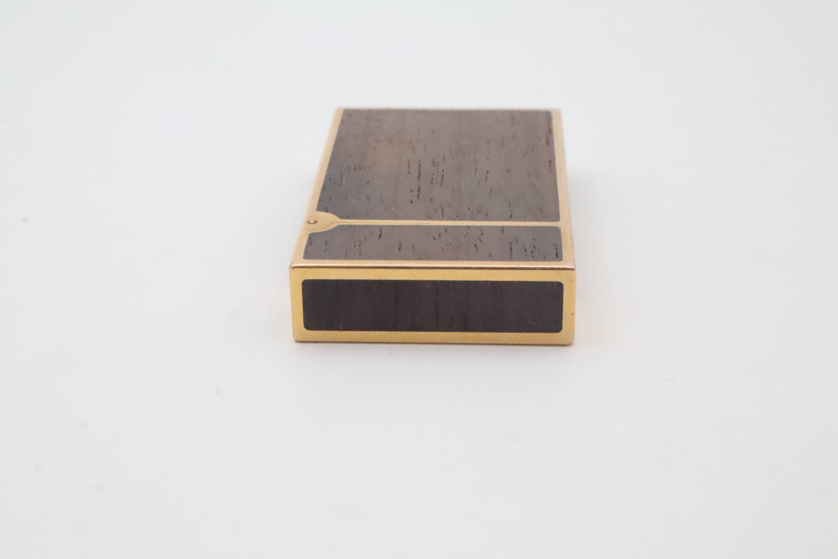 S.T. Dupont Ligne 2 gold plated lighter with dark wood inlay panels, marked MODELE on the base