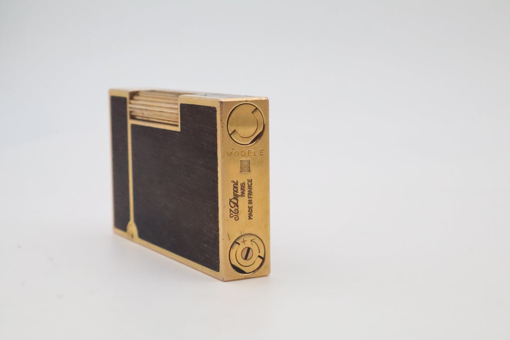S.T. Dupont Ligne 2 gold plated lighter with dark wood inlay panels, marked MODELE on the base