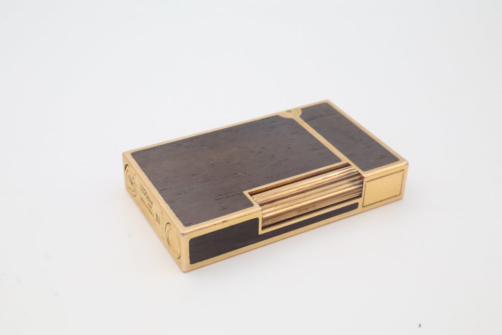 S.T. Dupont Ligne 2 gold plated lighter with dark wood inlay panels, marked MODELE on the base