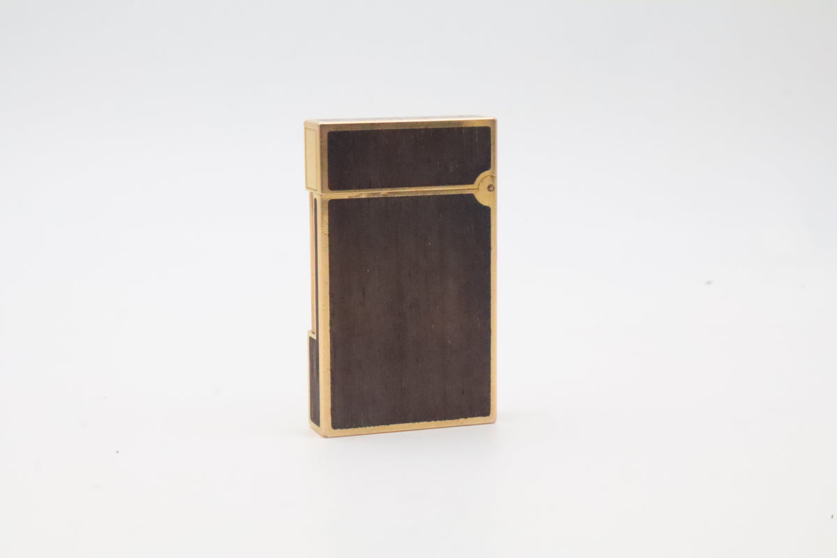 S.T. Dupont Ligne 2 gold plated lighter with dark wood inlay panels, marked MODELE on the base