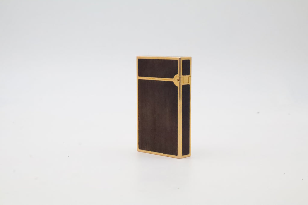 S.T. Dupont Ligne 2 gold plated lighter with dark wood inlay panels, marked MODELE on the base