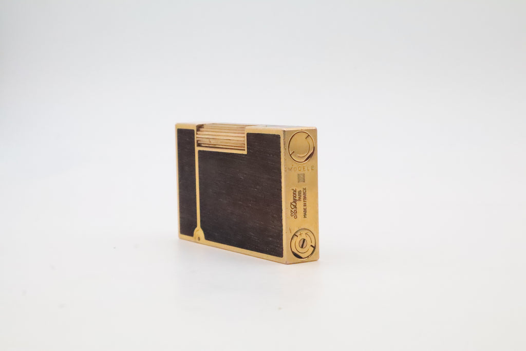 S.T. Dupont Ligne 2 gold plated lighter with dark wood inlay panels, marked MODELE on the base