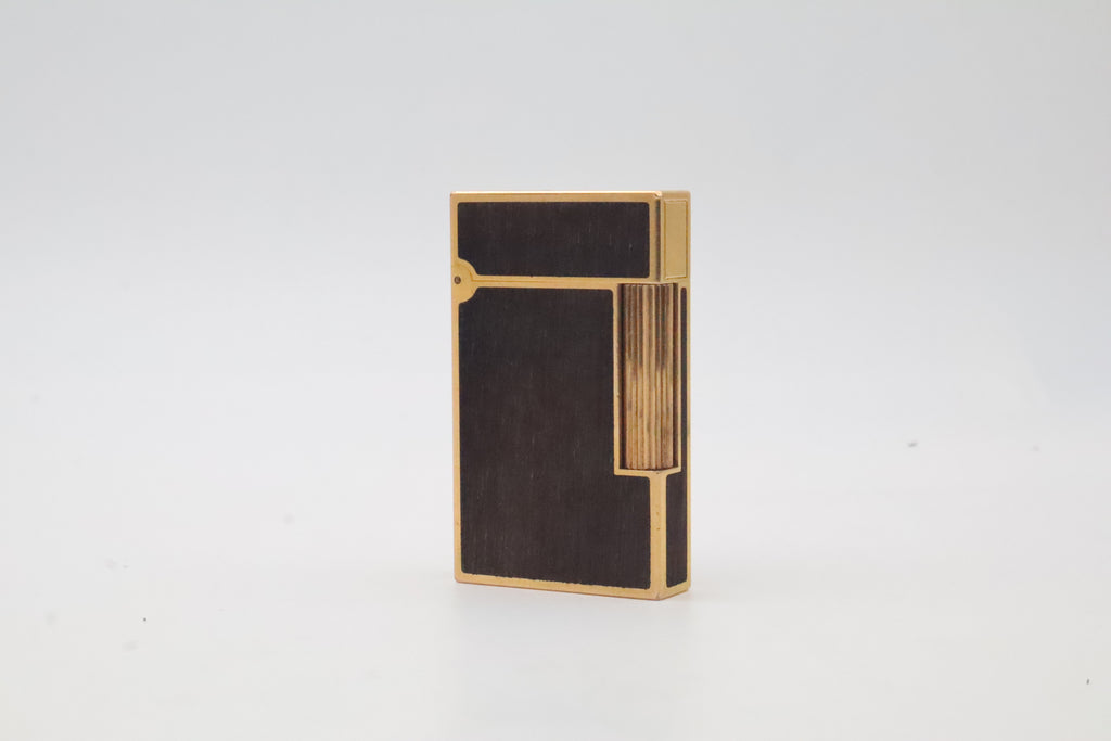 S.T. Dupont Ligne 2 gold plated lighter with dark wood inlay panels, marked MODELE on the base