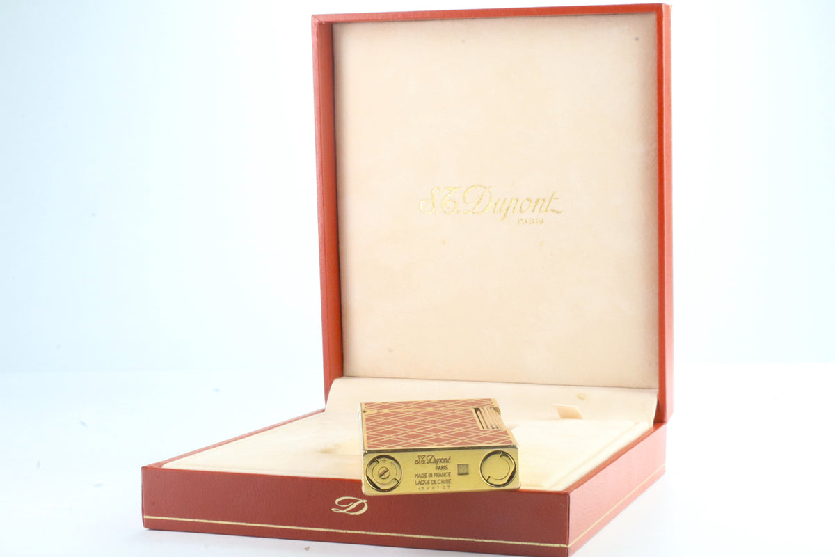 Base of the S.T. Dupont Ligne 2 rouge cloisonne lighter, engraved S.T. Dupont Paris Made in France
