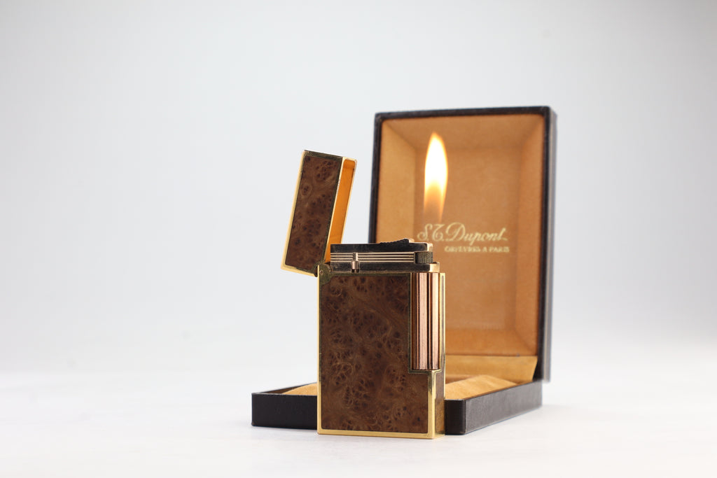 S.T. Dupont Ligne 2 real wood lighter open and lit, beside its original box