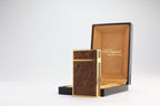 S.T. Dupont Ligne 2 Grand Modele lighter with figured burl wood panels and gold plated trim, with its original box