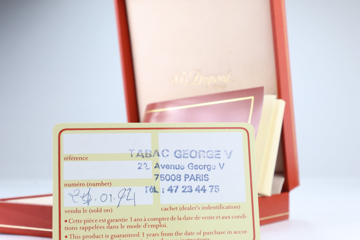 Guarantee card for the S.T. Dupont Ligne 2 Montparnasse, stamped by Tabac George V, Avenue George V, Paris, and dated 01-92