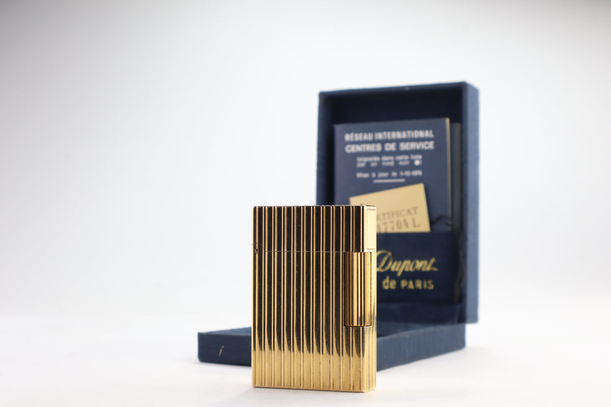 S.T. Dupont Ligne 2 pipe lighter in gold with vertical striping, with its navy box and numbered certificate