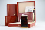 S.T. Dupont Ligne D lighter in marbled Normandie laque de chine with gold trim, with its red box, papers and numbered lacquer certificate